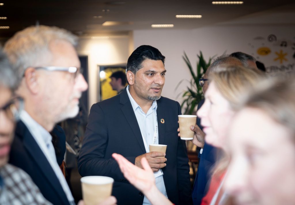 Business people standing chatting